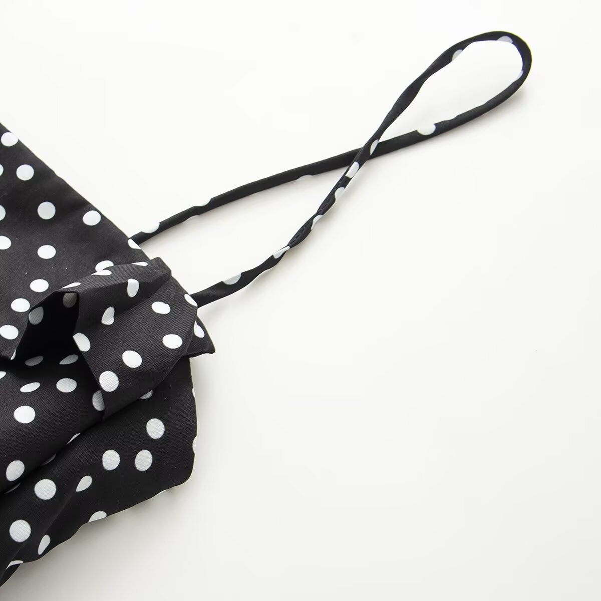 Women's sleeveless polka dot suspender dress
