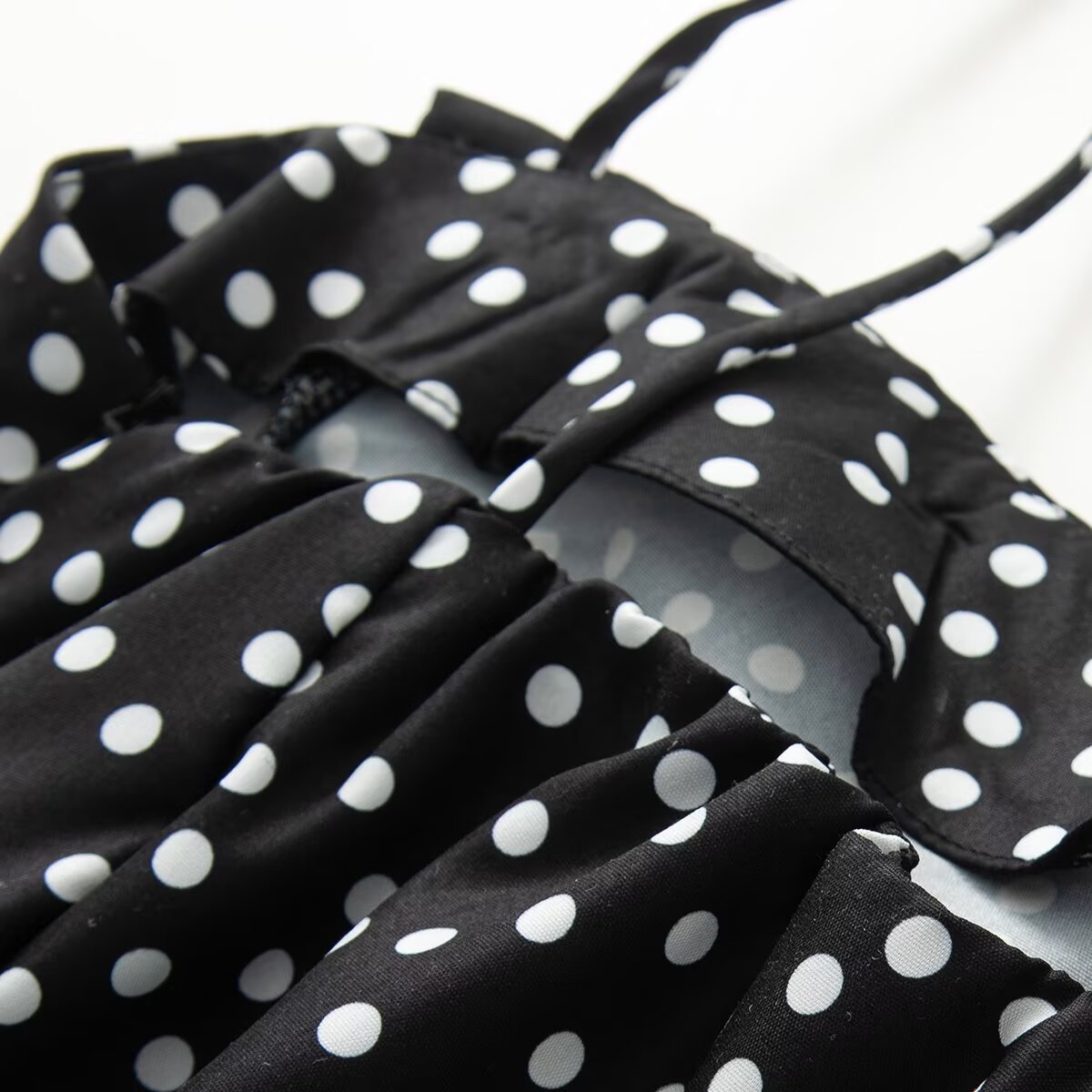 Women's sleeveless polka dot suspender dress