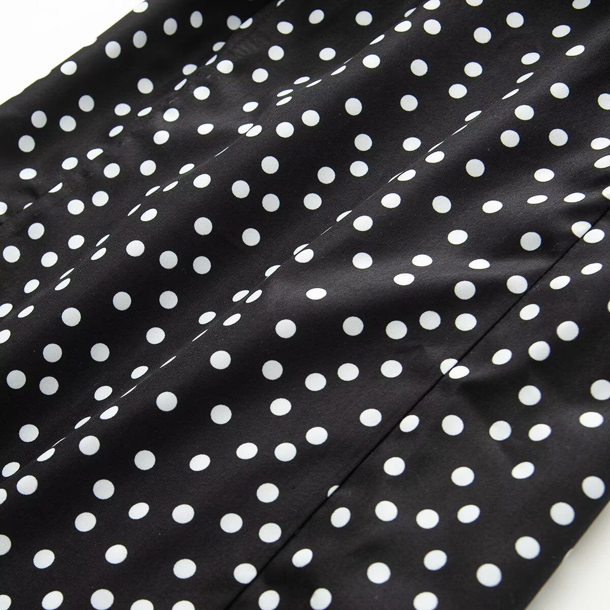 Women's sleeveless polka dot suspender dress