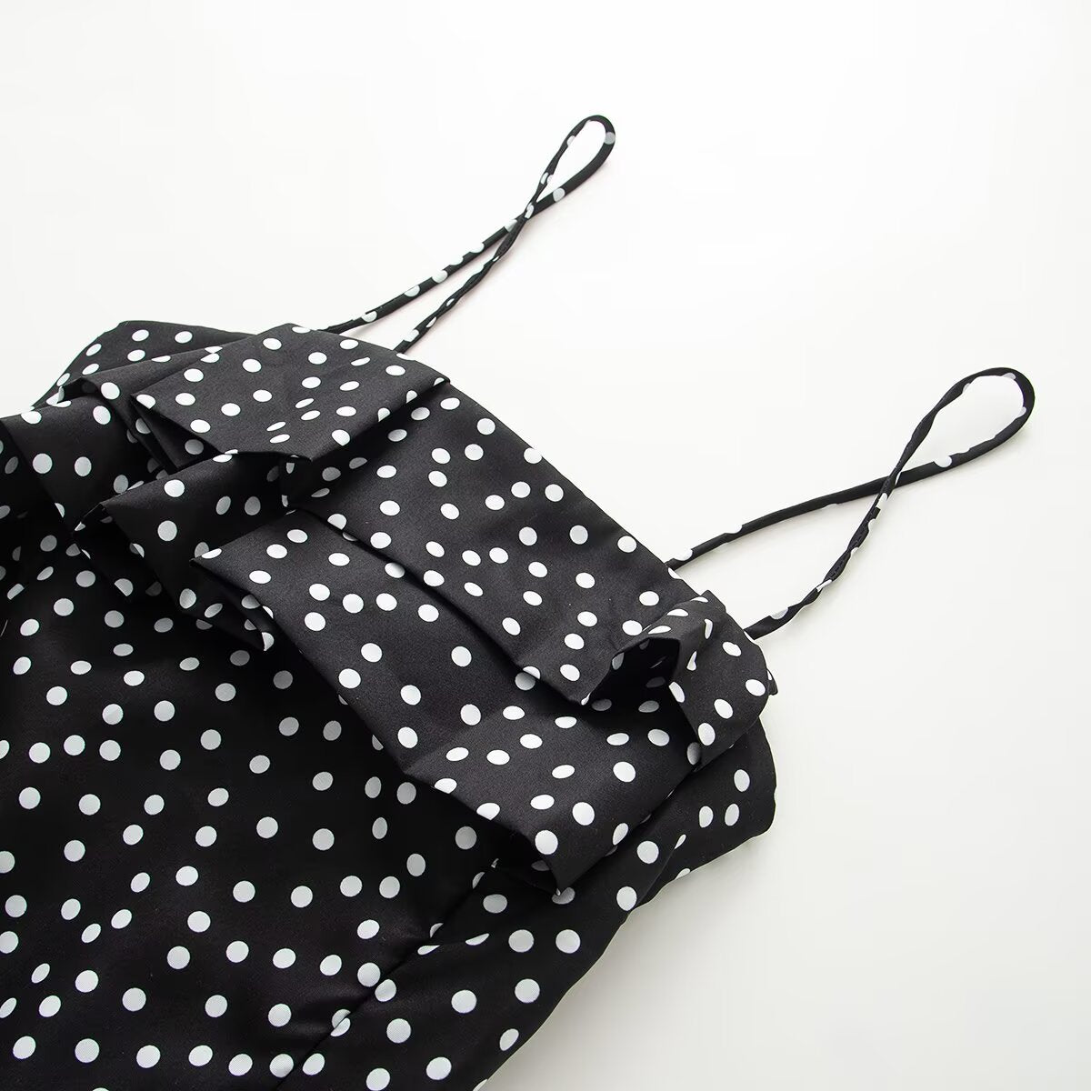Women's sleeveless polka dot suspender dress