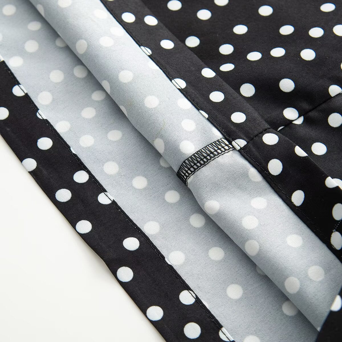 Women's sleeveless polka dot suspender dress