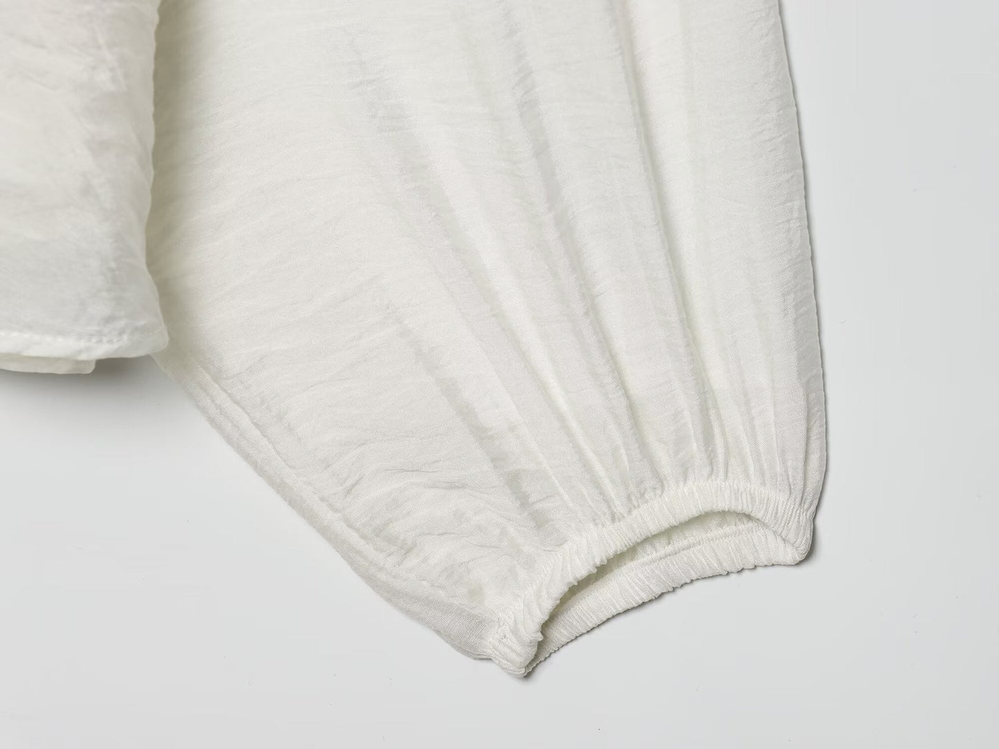 Women's layered decorative V-neck pleated shirt