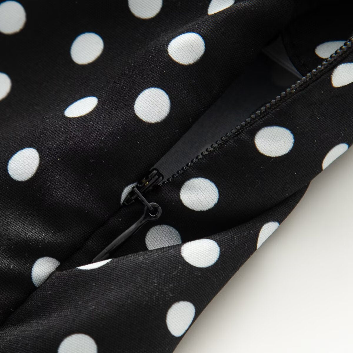 Women's sleeveless polka dot suspender dress